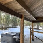 Custom reclaimed wood beam installation and handcrafted woodwork by JG Carpentry in Spearfish, SD featuring exposed structural beams and custom built-ins.